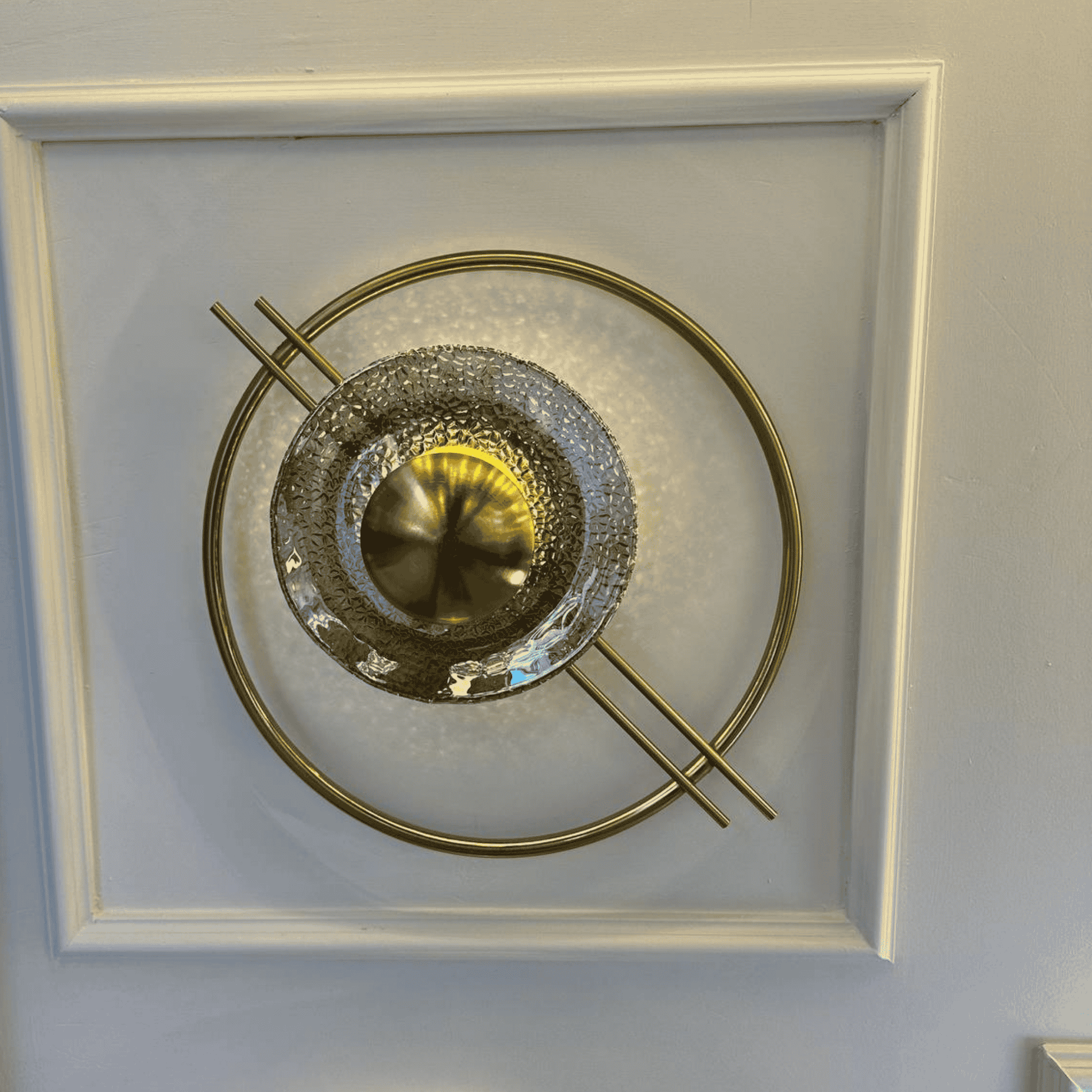 Angled perspective of brass and glass Art Deco wall light, ideal for stairway illumination with Mid-Century design.