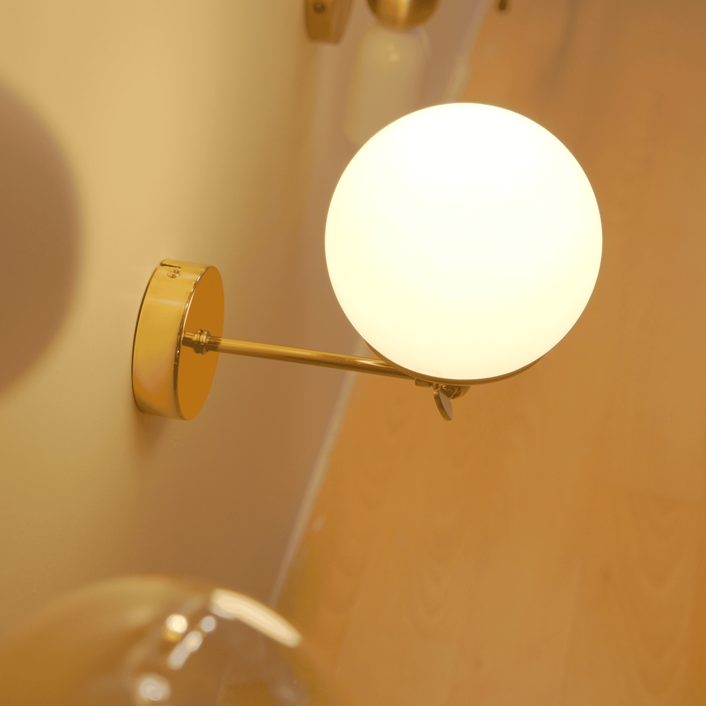 Modern Globe Wall Sconce with Adjustable Arm