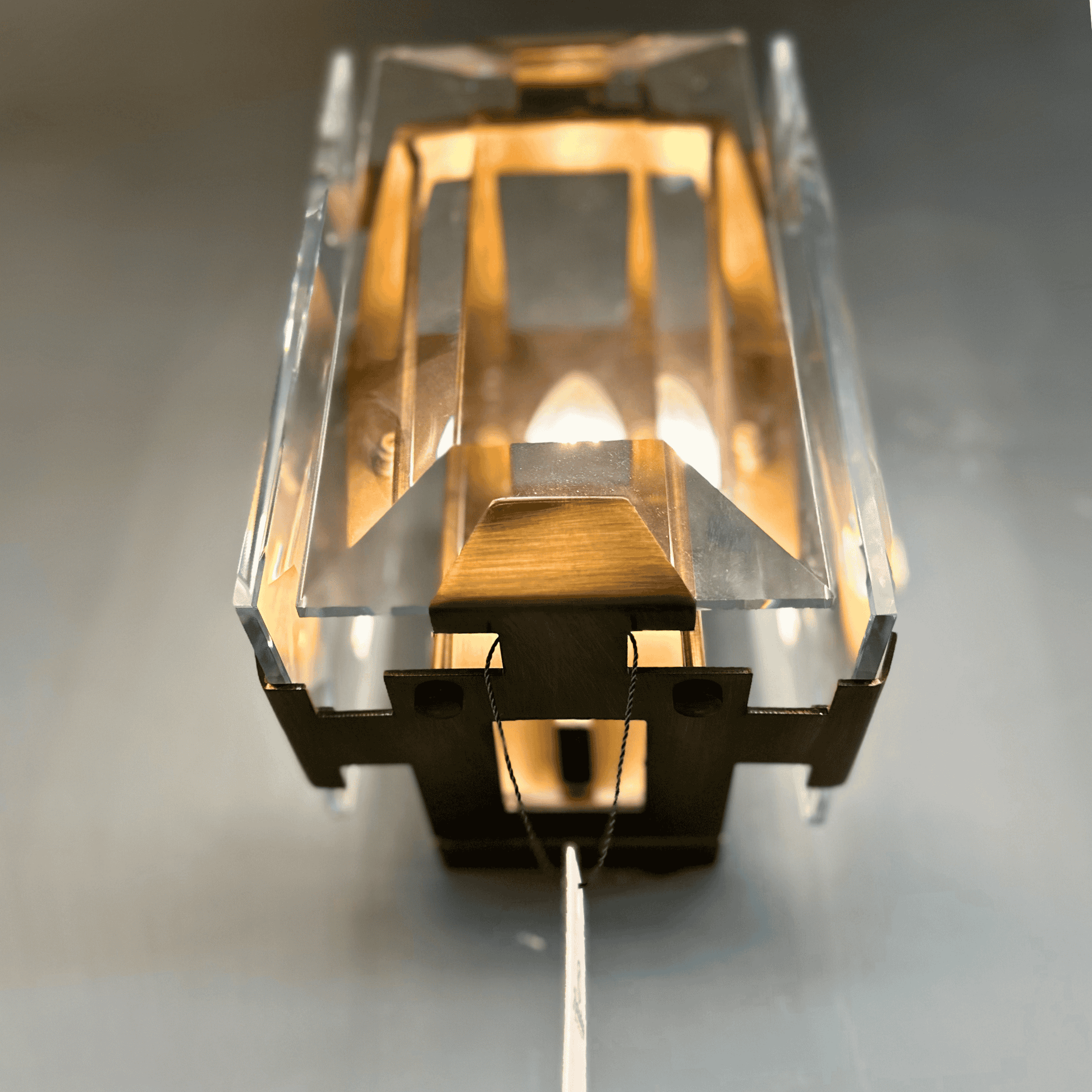 Art Deco-inspired brass wall light with crystal panels and pull chain