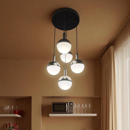 Bar area with globe pendant lighting creating a warm modern atmosphere.