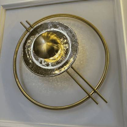 Concentric brass and glass wall light with strong Art Deco styling, ideal for stairway accent lighting.
