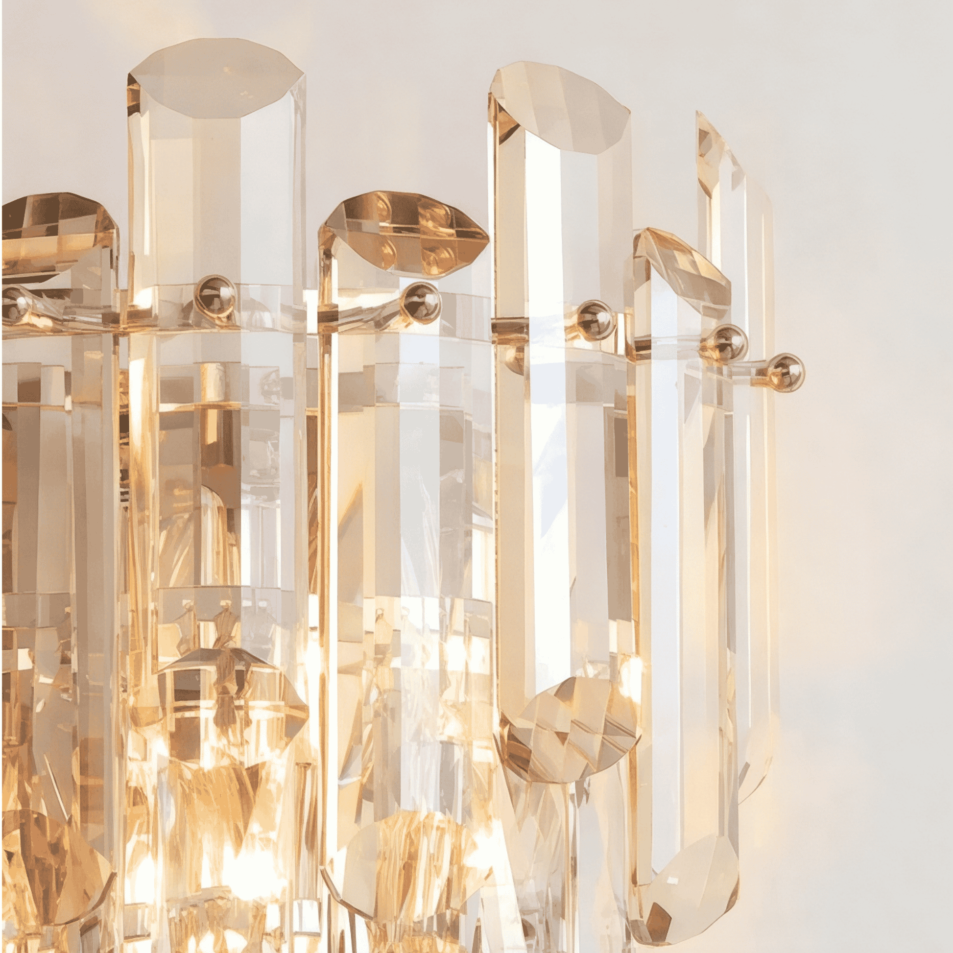 Detail view of smoked glass crystal wall sconce with warm lighting glow