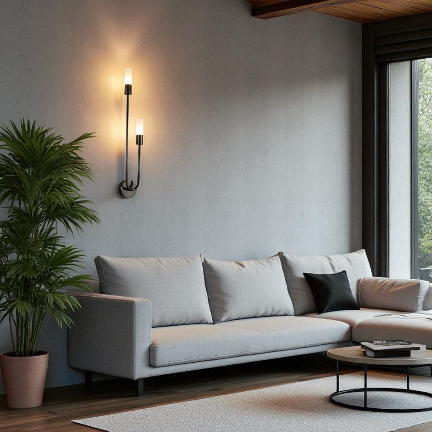 Modern black metal wall sconce with dual up and down lights illuminating a contemporary living room interior.