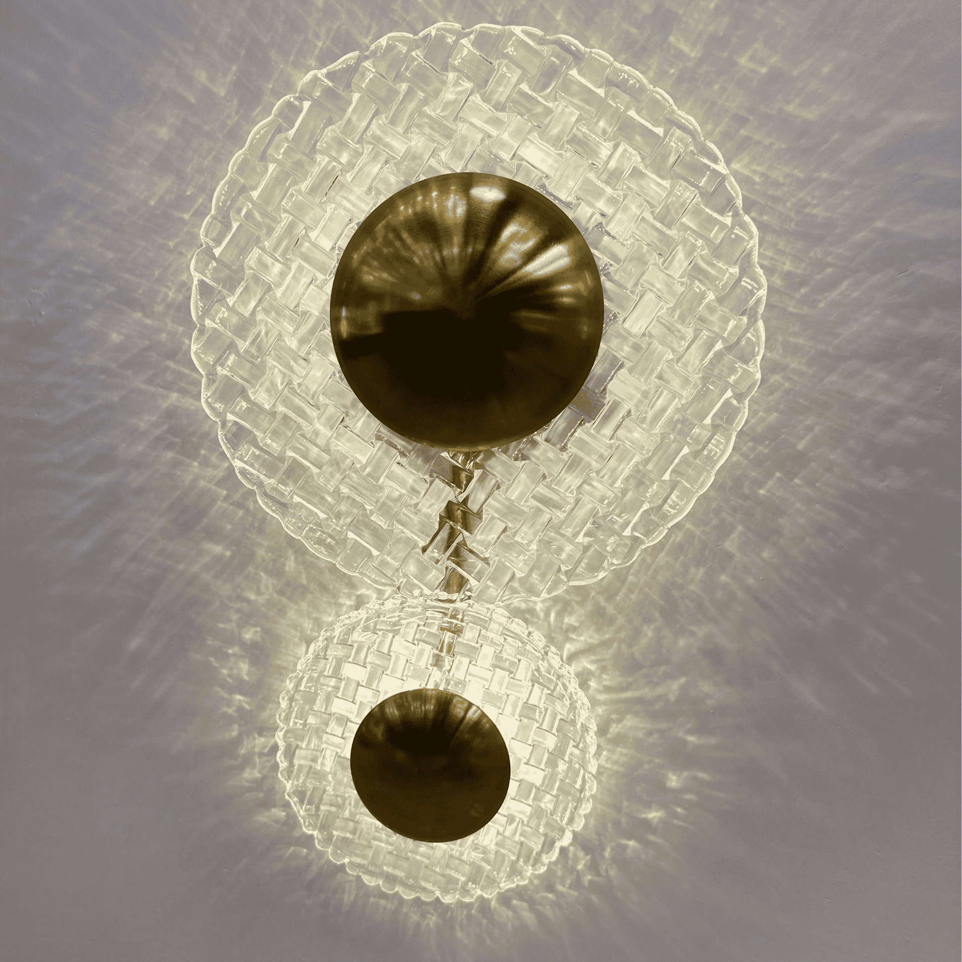 Upscale entryway wall sconce with clear glass and brass detailing creating a radiant light pattern.